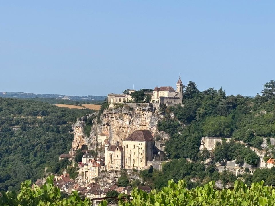 Panoramic view of Rocamadour castle and sanctuary built into the cliffs, a medieval hidden gem in France representing quiet luxury travel.